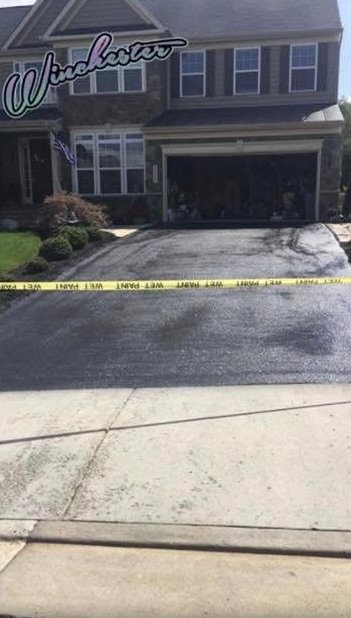 Asphalt driveway with stone border detail in Hedgesville, WV